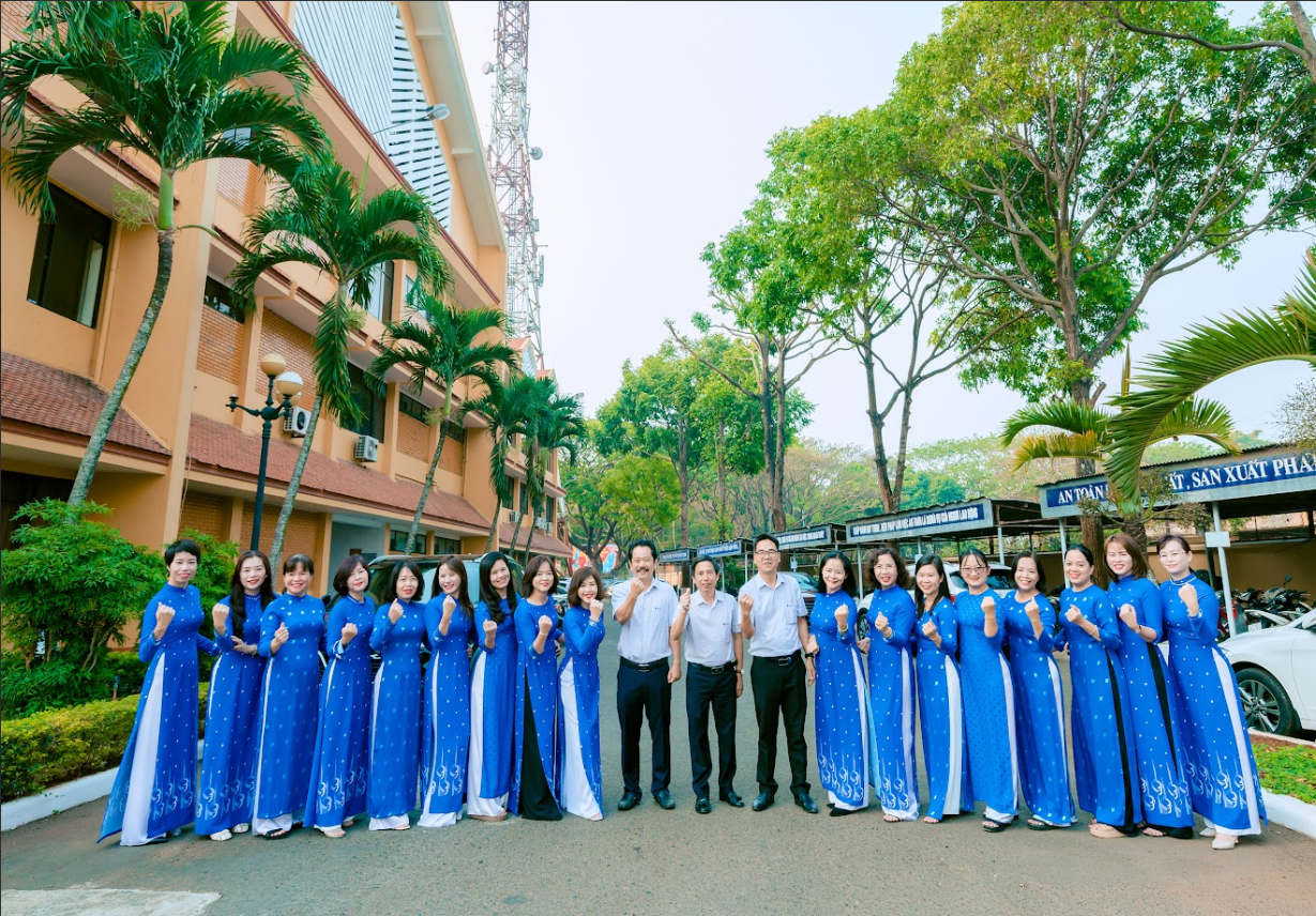 Description: A group of people in blue dresses
Description automatically generated