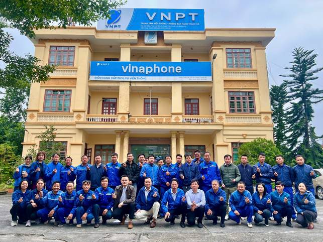 A group of people posing for a photo in front of a building

AI-generated content may be incorrect.