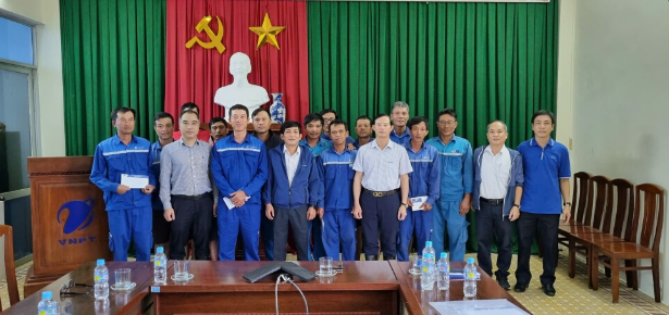 A group of people standing in front of a red and green curtain

AI-generated content may be incorrect.
