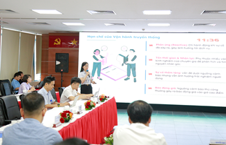 A group of people sitting at a table with a projector screen
AI-generated content may be incorrect.