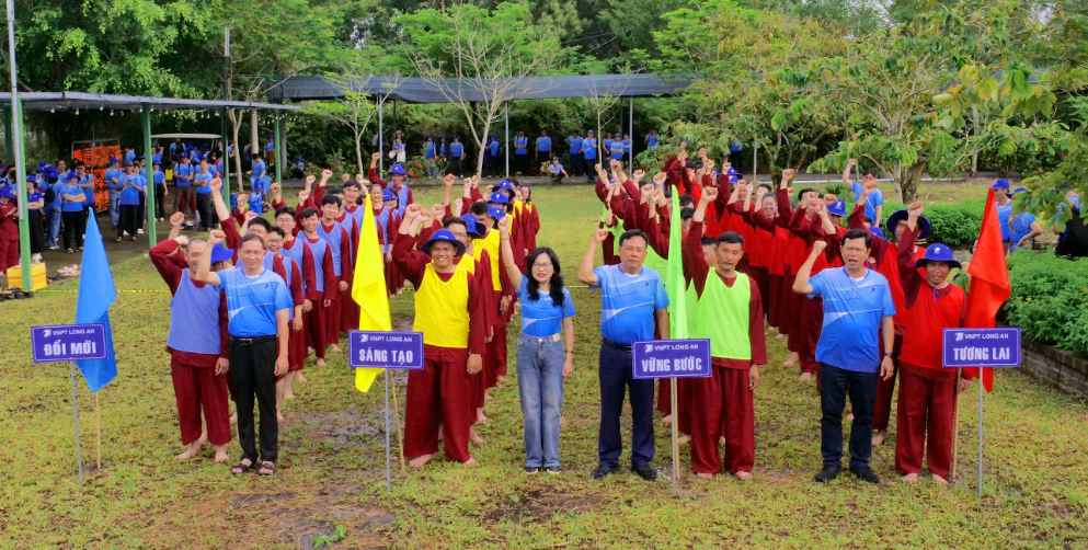 A group of people standing in a field holding signs
AI-generated content may be incorrect.