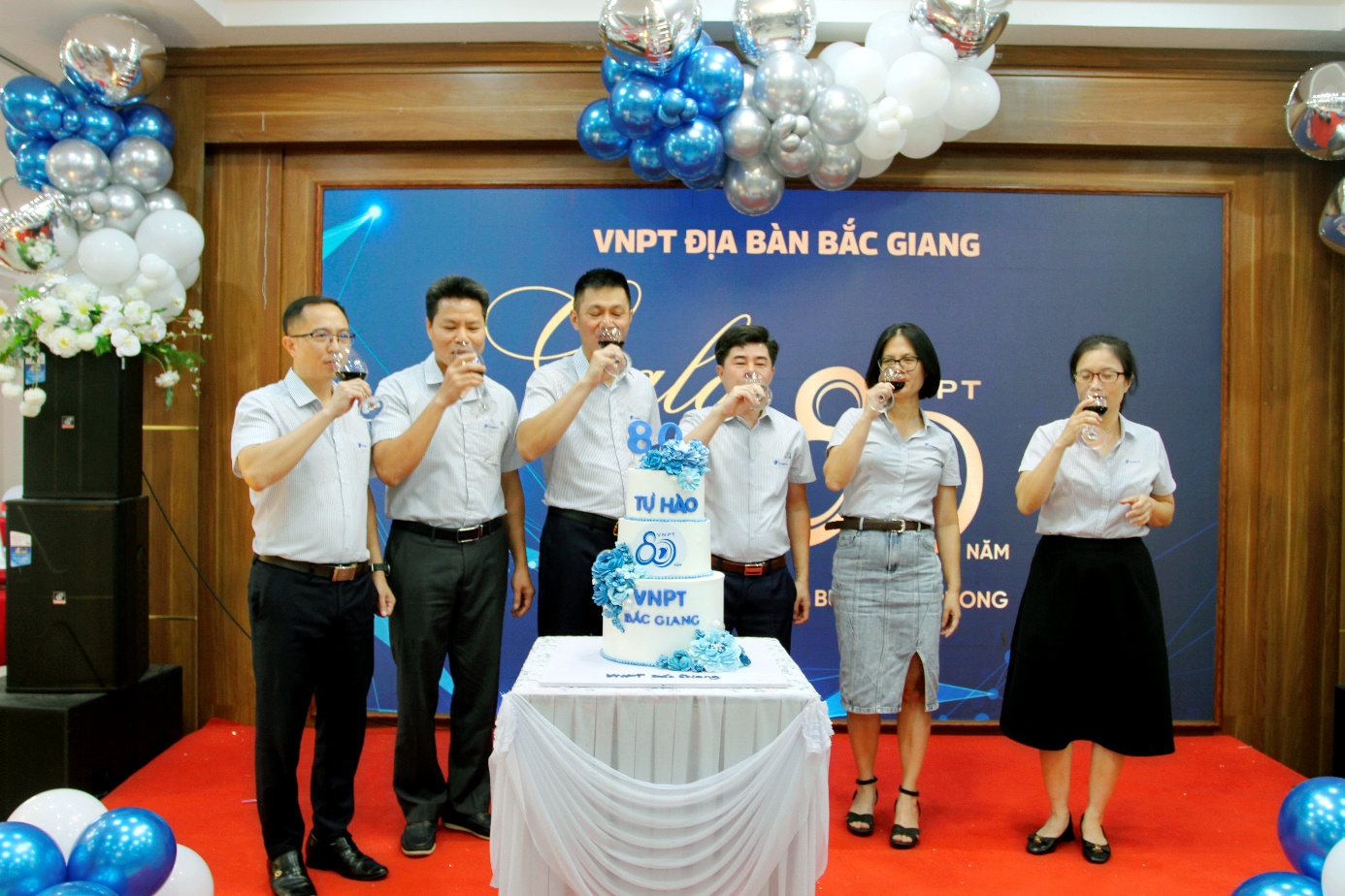 A group of people blowing into a cake
AI-generated content may be incorrect.