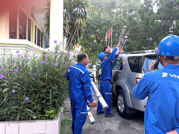 A group of men in blue uniforms holding poles

AI-generated content may be incorrect.