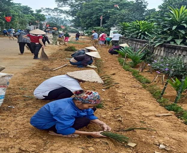 A group of people working in a garden