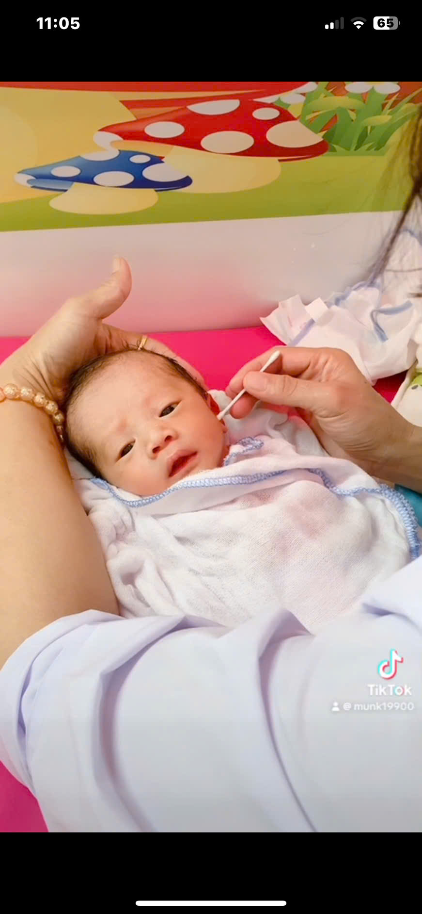 A baby being examined by a person
AI-generated content may be incorrect.