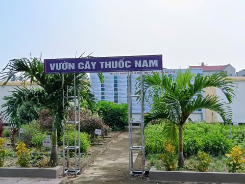 A sign with a ladder in front of a building
Description automatically generated
