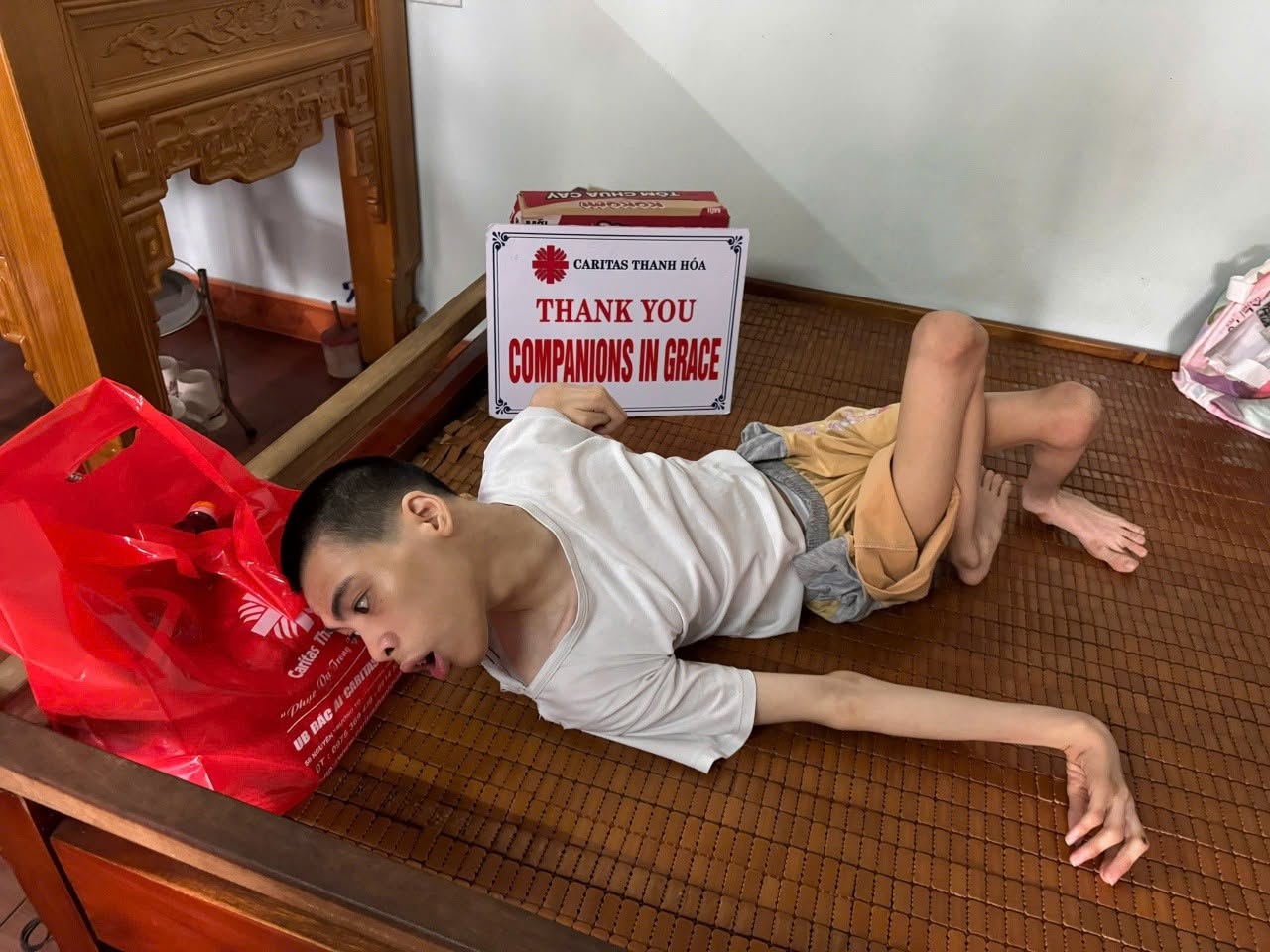 Có thể là hình ảnh về trẻ em và văn bản cho biết 'ИOCEb HenHnA CARITAS CARITASTHANHHÓA CARITASTHANHH THANH HÓA THANK YOU COMPANIONSI IN GRACE म् Caritas ไ็น みう CAAEH BAC មន UB SOM'