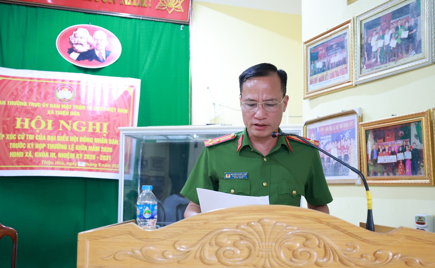 A person in uniform at a podium
Description automatically generated