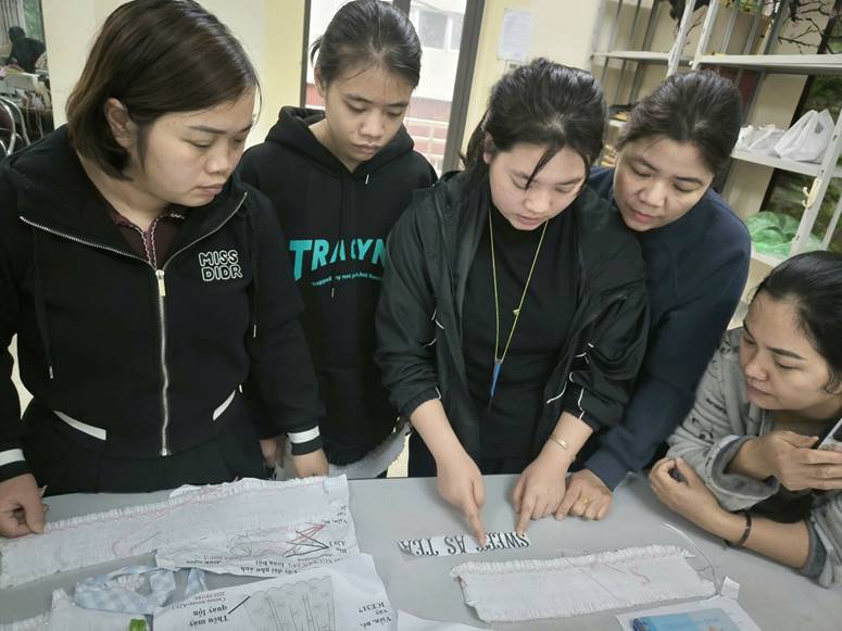 A group of women looking at papers
AI-generated content may be incorrect.