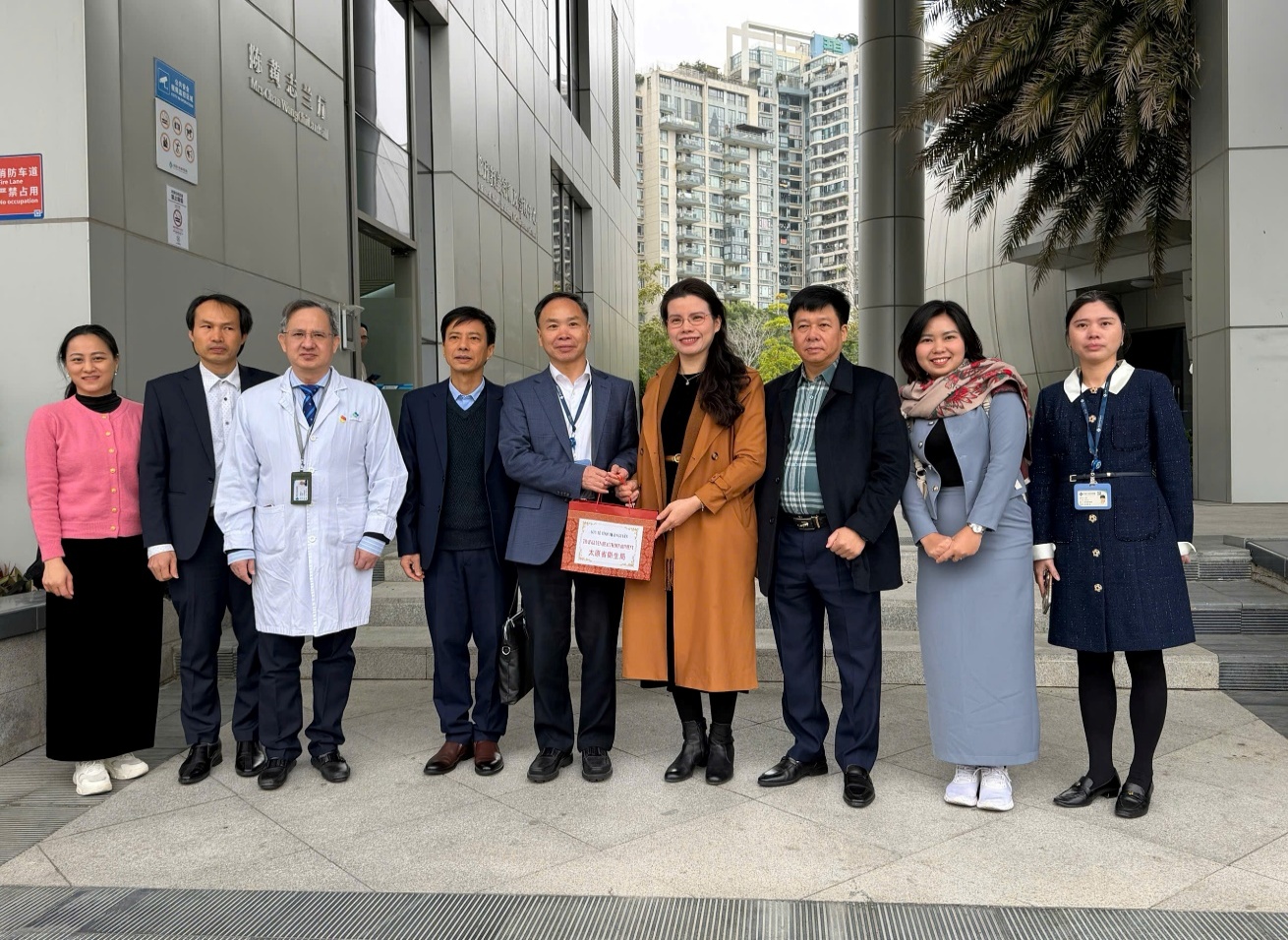 A group of people standing together outside a building
AI-generated content may be incorrect.