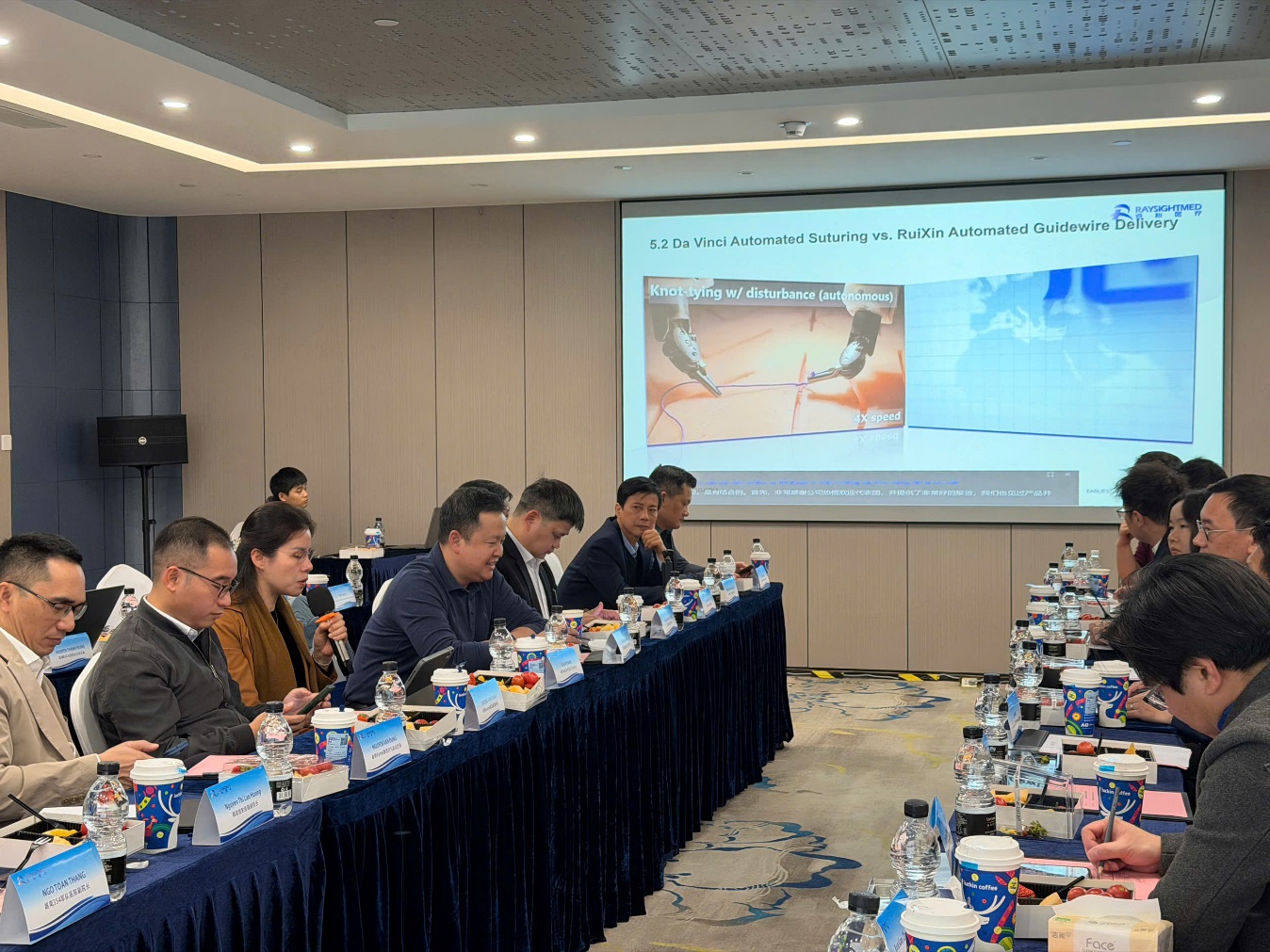 A group of people sitting at a table
AI-generated content may be incorrect.